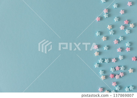 Easter Sugar Sprinkles in Shape of Stars on Blue Background 137869807