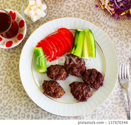 Turkish grilled meatballs, inegol kofte on plate Turkish grilled meatballs, inegol kofte on plate 137870346