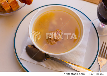 Catalan Christmas soup with meatballs, pasta and vegetables Catalan Christmas soup with meatballs, pasta and vegetables 137870362
