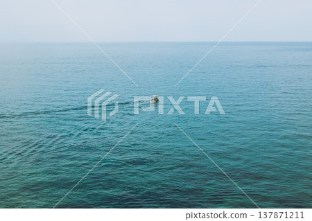 Amazing view of the Adriatic sea and a boat. Travel destination in Montenegro. Amazing view of the Adriatic sea and a boat. Travel destination in Montenegro. 137871211