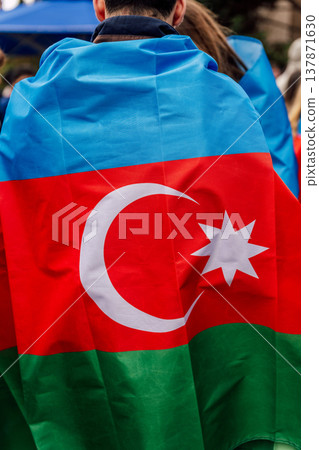 Person Wearing Azerbaijani Flag Showing Pride At Public Rally With Lively Background 137871630