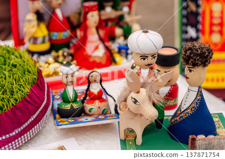 Decorative Folk Costumes And Miniature Animals Showcased Under Warm Ambient Lighting Decorative Folk Costumes And Miniature Animals Showcased Under Warm Ambient Lighting 137871754