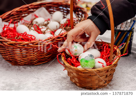 Festive Egg Decoration. Handcrafting Painted Eggs Surrounded By Vibrant Shredded Paper And Markers Festive Egg Decoration. Handcrafting Painted Eggs Surrounded By Vibrant Shredded Paper And Markers 137871870