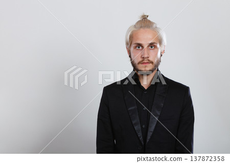 Attractive blonde man in bun Attractive blonde man in bun 137872358