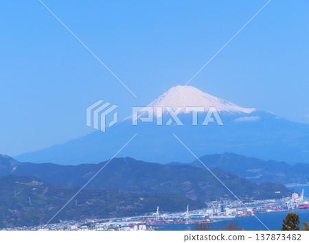 A view of Mt. Fuji and Shimizu Port under a blue sky in Shizuoka Prefecture, Japan. A view of Mt. Fuji and Shimizu Port under a blue sky in Shizuoka Prefecture, Japan. 137873482
