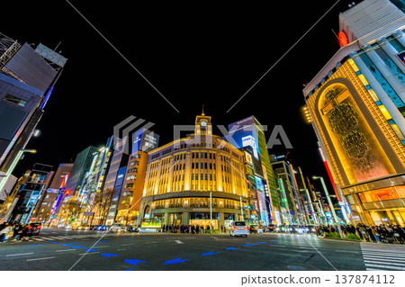 A night view of the Ginza area in Chuo Ward, Tokyo, near the Ginza 4-chome intersection. A night view of the Ginza area in Chuo Ward, Tokyo, near the Ginza 4-chome intersection. 137874112