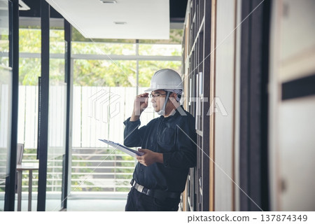 Man construction engineer writing note wear blue shirt safety white hard hat at construction site. Industry labour male worker. Architecture man drawing engineer civil constrcution real estate Man construction engineer writing note wear blue shirt safety white hard hat at construction site. Industry labour male worker. Architecture man drawing engineer civil constrcution real estate 137874349