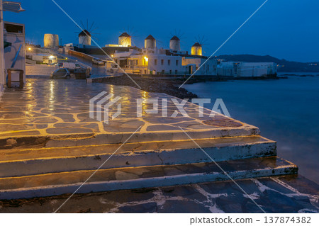 Mykonos town with illuminated windmills at blue hour Greece Mykonos town with illuminated windmills at blue hour Greece 137874382