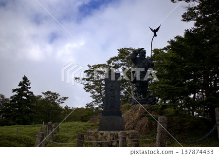The statue of Emperor Jimmu at Odaigahara and white clouds spreading across the blue sky. The statue of Emperor Jimmu at Odaigahara and white clouds spreading across the blue sky. 137874433