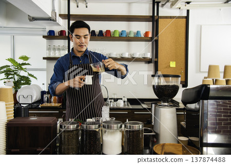 Close up hands coffee barista man make hot cup espresso shot from coffee machine. Cappuccino with milk in italian coffee shop cafe. Close up hands of barista use machine make black drinking hot cup Close up hands coffee barista man make hot cup espresso shot from coffee machine. Cappuccino with milk in italian coffee shop cafe. Close up hands of barista use machine make black drinking hot cup 137874488