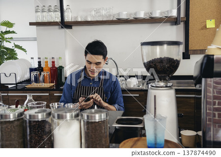 Portrait Barista small business Owner. Asian barista man coffee shop owner smiling look at camera small business confident person Entrepreneur manager professional men standing coffee counter bar 137874490