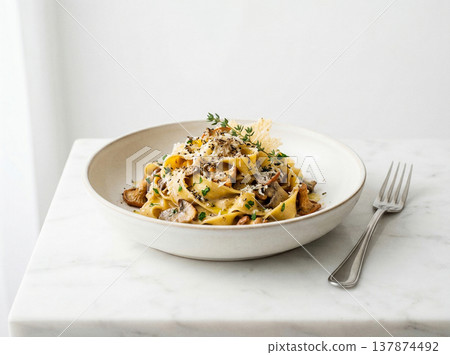 Rich tagliatelle pasta with mushroom and meat sauce, garnished with parmesan cheese and herbs, italian cuisine, food photography Rich tagliatelle pasta with mushroom and meat sauce, garnished with parmesan cheese and herbs, italian cuisine, food photography 137874492