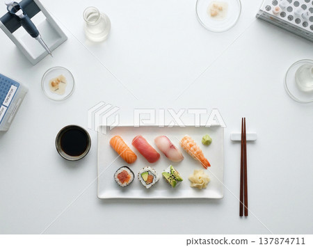 Overhead view of sushi platter with chopsticks and soy sauce with japanese food Overhead view of sushi platter with chopsticks and soy sauce with japanese food 137874711