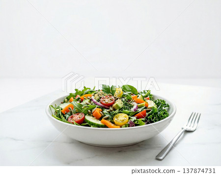 Healthy mixed green salad with cherry tomatoes, cucumber, and onion in a white bowl, garden salad Healthy mixed green salad with cherry tomatoes, cucumber, and onion in a white bowl, garden salad 137874731