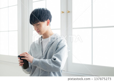 A man holding a protein shaker A man holding a protein shaker 137875273
