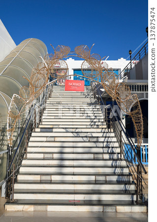 Egypt, Sharm el-Sheikh - September 27, 2025 Soho tourist area during the day. A staircase under an arch of garlands Editorial 137875474