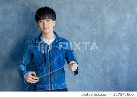 Man in denim work clothes Man in denim work clothes 137875660