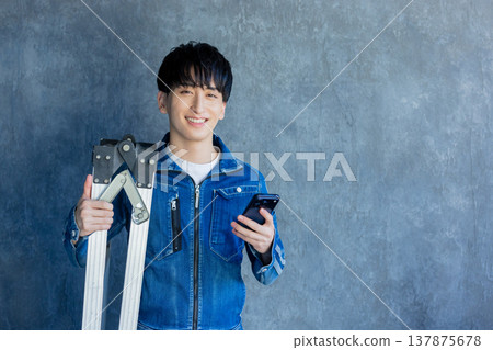 Man in denim work clothes Man in denim work clothes 137875678