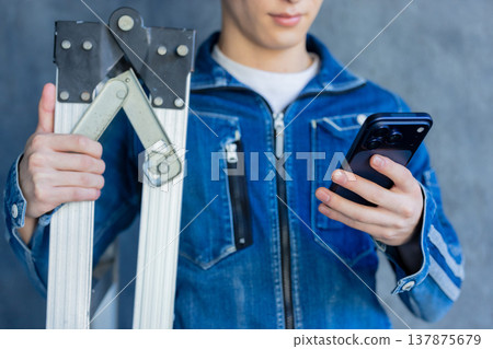 Man in denim work clothes Man in denim work clothes 137875679