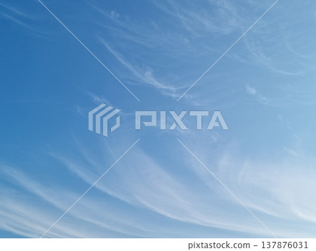 Blue sky with feathery clouds. Blue sky with feathery clouds. 137876031