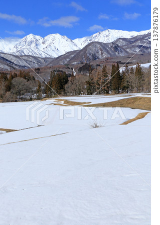 The Northern Alps in early spring as seen from Tsugaike Plateau The Northern Alps in early spring as seen from Tsugaike Plateau 137876179