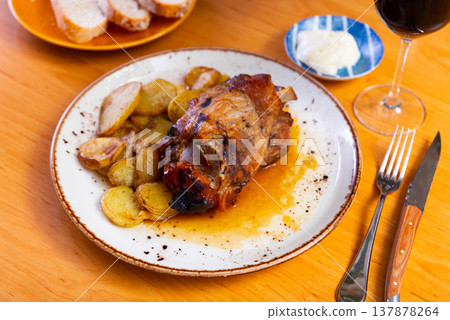 Appetizing pork knuckle served on platter Appetizing pork knuckle served on platter 137878264