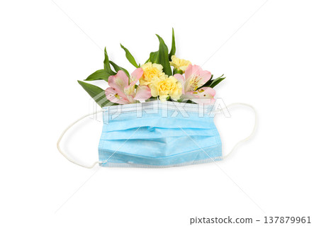A mask holds colorful flowers to honor nurses, isolated, PNG A mask holds colorful flowers to honor nurses, isolated, PNG 137879961