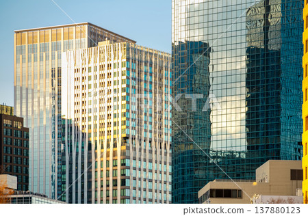 The evening sky reflected in the windows of the skyscrapers The evening sky reflected in the windows of the skyscrapers 137880123