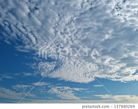 Blue sky and flake clouds. 137880269