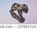 Ornamental dinosaur skull sculpture studded with colorful gems and polished metal 137881314