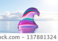 Wave sculpture with jewel-like curl and iridescent colors on a mirrored sea plane 137881324