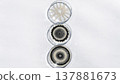 Three petri dishes with distinct circular patterns on a white background 137881673