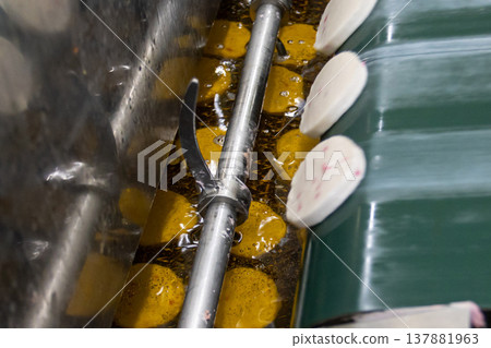 Kamaboko factory: The process of making fried kamaboko. Kamaboko factory: The process of making fried kamaboko. 137881963