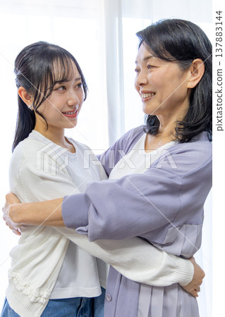 A portrait of a close mother and daughter. A portrait of a close mother and daughter. 137883144