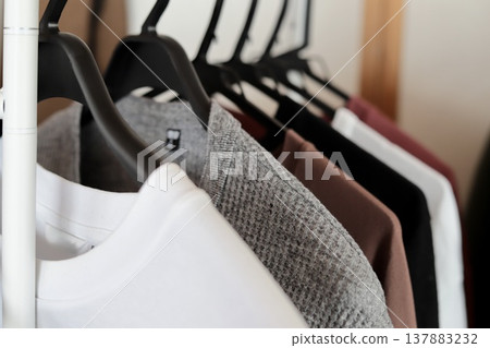 Various types of men's T-shirts drying indoors Various types of men's T-shirts drying indoors 137883232
