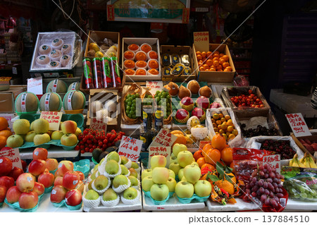 Fruits such as oranges sold at the open-air market. Most of them are imported. 137884510
