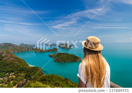 Young woman looking at tropical islands in Ang Thong National Marine Park, Thailand Young woman looking at tropical islands in Ang Thong National Marine Park, Thailand 137884555