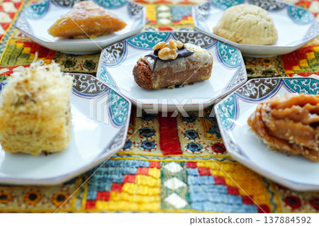 A selection of traditional Turkish sweets, including baklava, and other Middle Eastern desserts. A selection of traditional Turkish sweets, including baklava, and other Middle Eastern desserts. 137884592