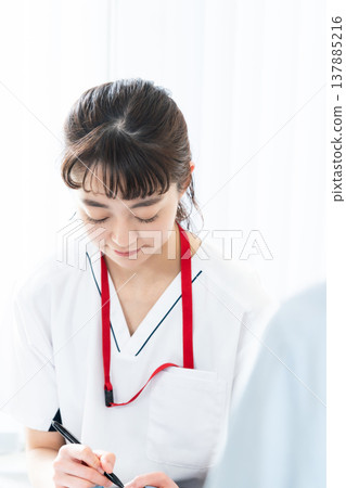 Healthcare worker explaining to patient Healthcare worker explaining to patient 137885216