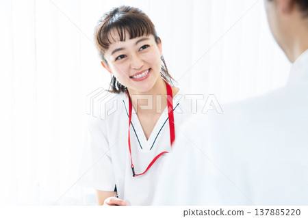 Healthcare worker explaining to patient Healthcare worker explaining to patient 137885220