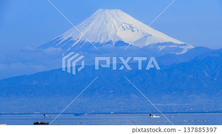 Mount Fuji and a yacht in winter, as seen from Kou, Numazu City, West Izu Peninsula, Shizuoka Prefecture. Mount Fuji and a yacht in winter, as seen from Kou, Numazu City, West Izu Peninsula, Shizuoka Prefecture. 137885397