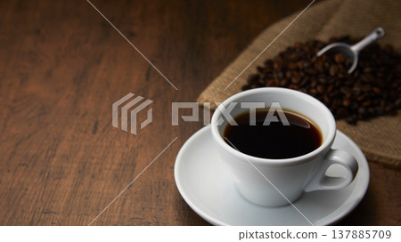 A coffee image with a calm wood grain background. A coffee image with a calm wood grain background. 137885709