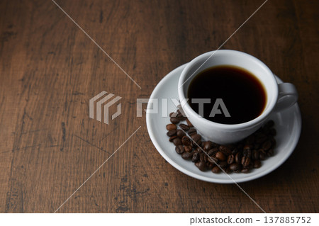 A coffee image with a calm wood grain background. A coffee image with a calm wood grain background. 137885752