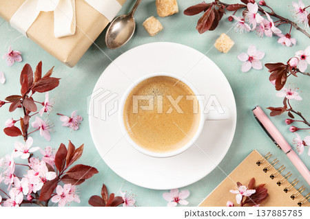 Spring Coffee Flat Lay with Blossoms, Gift and Notebook Spring Coffee Flat Lay with Blossoms, Gift and Notebook 137885785