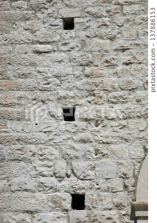 Stone Wall with Narrow Defensive Windows in Korcula Stone Wall with Narrow Defensive Windows in Korcula 137886153