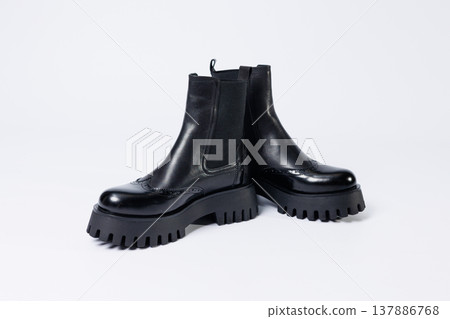 Women's black boots with genuine leather on a rough sole without laces. New collection of women's spring shoes Women's black boots with genuine leather on a rough sole without laces. New collection of women's spring shoes 137886768