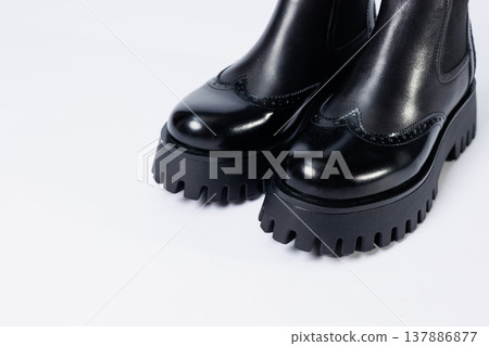 Women's black boots with genuine leather on a rough sole without laces. New collection of women's spring shoes 137886877