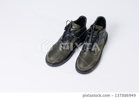 Leather short men's boots on a white background. Winter boots collection 2022. Leather short men's boots on a white background. Winter boots collection 2022. 137886949