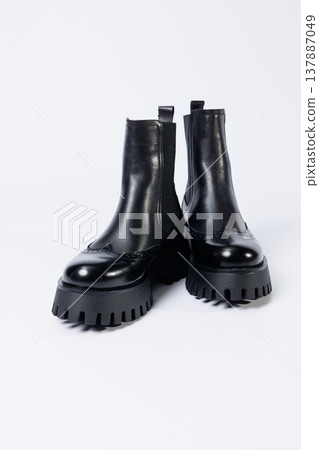 Women's black boots with genuine leather on a rough sole without laces. New collection of women's spring shoes Women's black boots with genuine leather on a rough sole without laces. New collection of women's spring shoes 137887049
