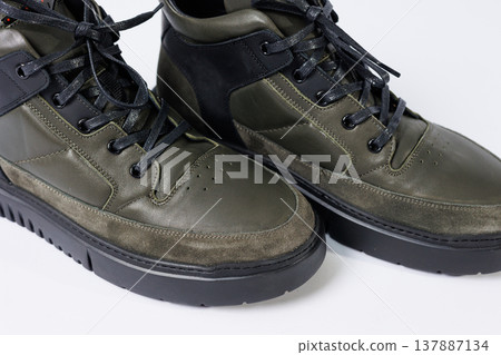Leather short men's boots on a white background. Winter boots collection 2022. Leather short men's boots on a white background. Winter boots collection 2022. 137887134
